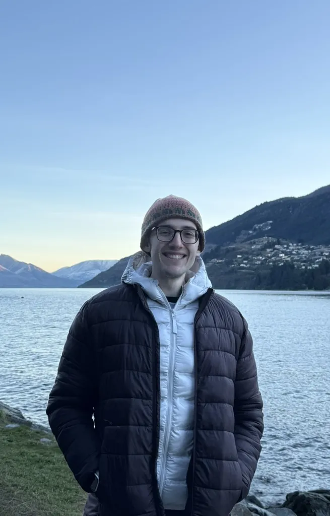 Steven Winnick beside a lake in the mountains
